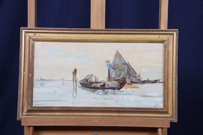 un tableau posé sur un chevalet représentant un homme dans un bateau