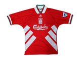a close up of a red and white soccer jersey with a star on the chest