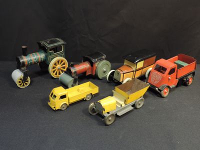 many different types of toy trains on a black background