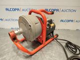 a close up of a pump on a table with a hose