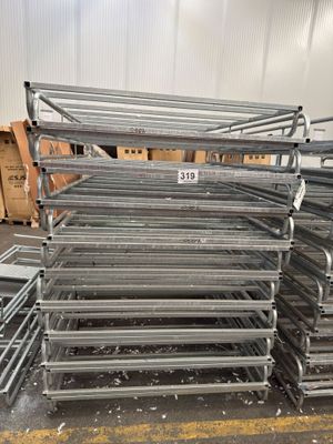 a pile of metal shelves in a warehouse with boxes and boxes