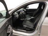 the interior of a car with the door open and the driver ' s seat down
