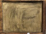 an old picture of a man ' s face is shown in a wooden frame