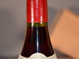 a bottle of wine that is sitting on a table