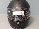 a helmet with a sticker on it sitting on a table