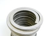 a close up of a metal pipe on a white surface