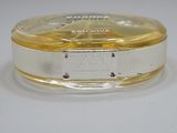 a close up of a silver and gold plate with a white background