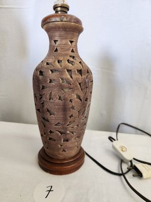 a lamp that is sitting on a table next to a computer mouse