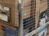 a cart with boxes on top of it in a warehouse