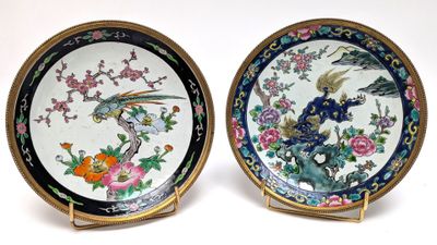 pair of chinese porcelain plates with birds and flowers on them