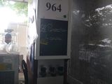 a machine that is sitting in the corner of a room