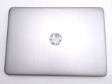 a laptop with a hp logo on the screen