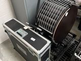 a black case sitting next to a stack of musical equipment