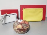 two purses and a coin jar on the table