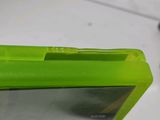 a close up of a green plastic case on a table