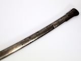 an old baseball bat on a white surface