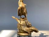 bronze statue of a woman riding a horse on top of a turtle