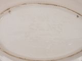 a close up of a white plate with writing on it