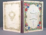an old book opened to reveal a picture of a flowered cover