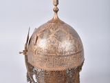 an old helmet with a chain around it on a white background