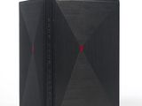 une image représentant un livre noir avec un point rouge sur la couverture