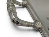 a silver tray with a mirror on it on a white surface