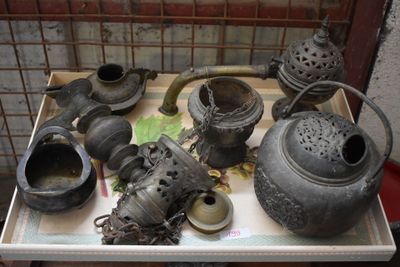 a tray that has a lot of old pots and pans on it