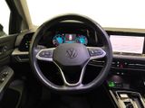 the interior of a car with a steering wheel and dashboard controls