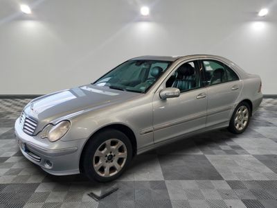 a picture of a silver mercedes s - class parked on a checkered floor