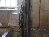 a dirty bathtub in a dirty bathroom with a window