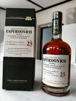 the bottle of the single malt is next to the box of the single malt