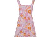 a pink dress with orange and white flowers on it