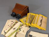 a small box of cards and a camera on a table