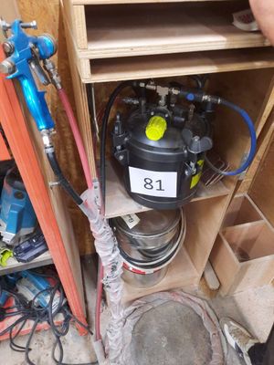 a man that is standing next to a water heater