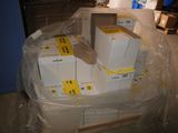 a pile of boxes sitting on a pallet in a warehouse