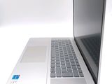 a laptop computer that is open on a white surface