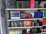 a lot of beauty products on the shelves in the room