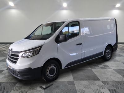 the white van is parked on a checkered floor in a room
