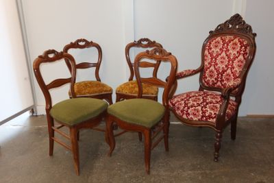 four chairs are lined up in a row in a room