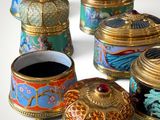 five different types of decorative boxes on a white surface