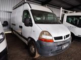 two white vans parked in a garage next to each other
