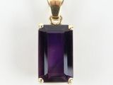an image of a purple stone pendant on a white background