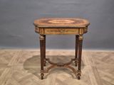 a small table with a wooden top on a wooden floor