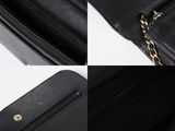 a close up of a black purse with a chain around it