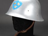 a silver helmet with a blue star on the side