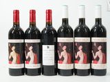 six bottles of red wine are lined up on a white surface