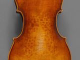an old violin with a wooden back and a long neck