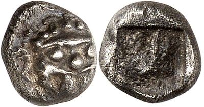a silver coin with an image of a lion on it