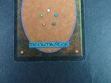 a close up of a deckmaster card on a table