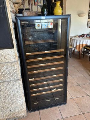 a wine cooler in the corner of a room
